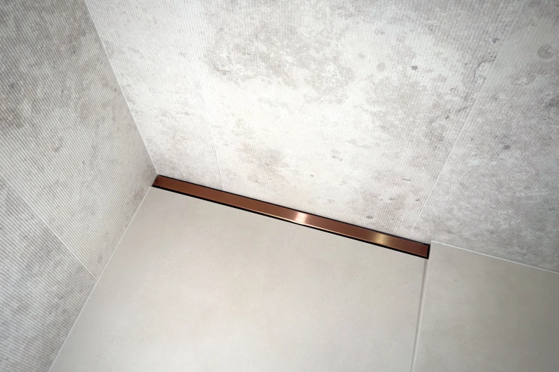 Odpływ liniowy przyścienny ze spadkiem jednospadowym - line PRO różowe złoto szczotkowane